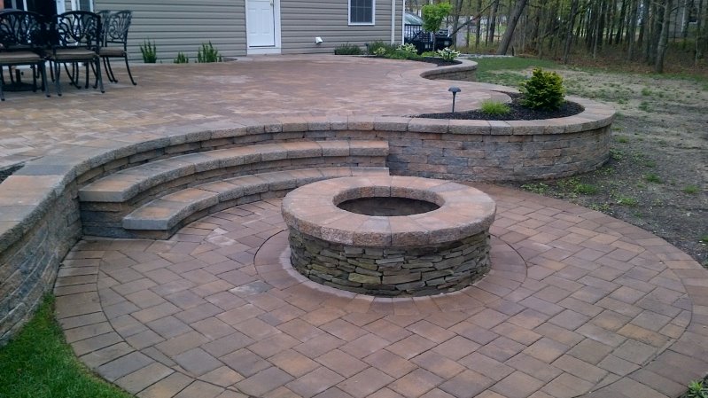 circular fire pit patio in backyard