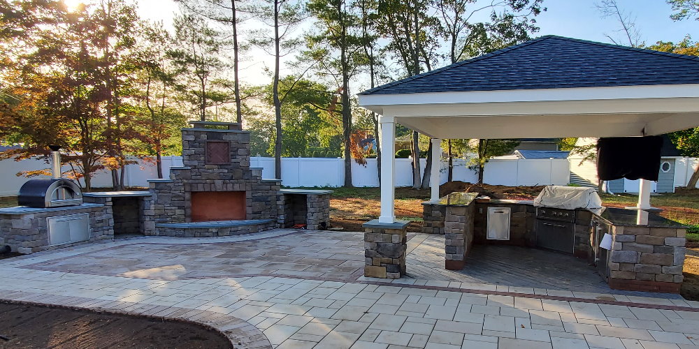 outdoor kitchen with pavilion and fireplace and pizza oven