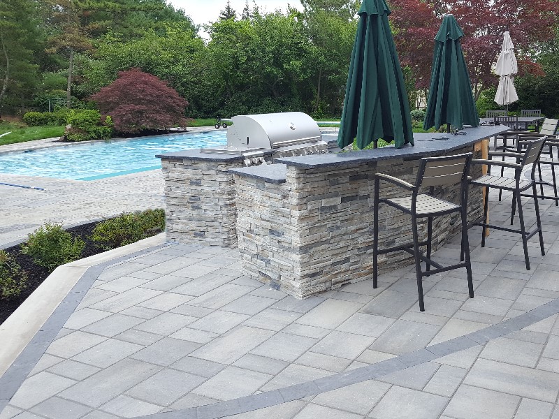 Pool patio with moss rock coping