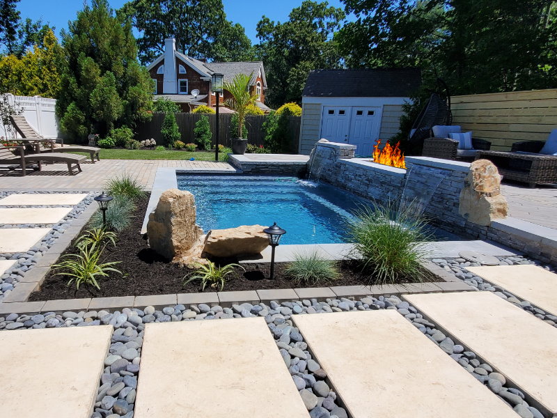 Pool patio with moss rock coping