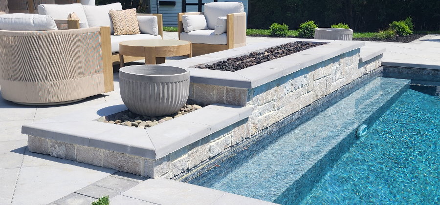 fire pit at edge of pool